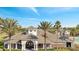 Beautiful brick clubhouse with large windows, tile roof, and manicured landscaping at 11901 Sandy Knoll Ct # 814, Orlando, FL 32825