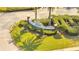 Landscaped community entrance featuring the 'Heritage Estates' sign and manicured shrubs at 11901 Sandy Knoll Ct # 814, Orlando, FL 32825