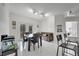 Open dining area with modern furnishings adjacent to kitchen with sliding door access to the exterior at 11901 Sandy Knoll Ct # 814, Orlando, FL 32825