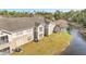 A well-maintained condominium exterior shows a view of a community pond at 11901 Sandy Knoll Ct # 814, Orlando, FL 32825