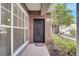 Charming front door with brick accents and manicured landscaping creates a welcoming entrance at 11901 Sandy Knoll Ct # 814, Orlando, FL 32825