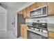Kitchen showcases stainless appliances, granite countertops, and wood cabinetry at 11901 Sandy Knoll Ct # 814, Orlando, FL 32825