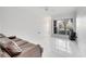 Bright and airy living room with elegant tile flooring and abundant natural light at 11901 Sandy Knoll Ct # 814, Orlando, FL 32825