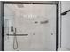 Close-up of a shower with sleek black hardware and marble-style tile at 11901 Sandy Knoll Ct # 814, Orlando, FL 32825