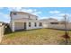 Exterior home view with backyard, patio, and lawn at 1260 Tupelo Trl, Haines City, FL 33844
