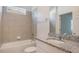 Bright bathroom featuring a granite countertop, tub, and tile surround at 1260 Tupelo Trl, Haines City, FL 33844