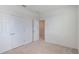 Bedroom with carpet, and closet with double doors at 1260 Tupelo Trl, Haines City, FL 33844