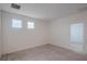 Bedroom with carpet and two windows and door at 1260 Tupelo Trl, Haines City, FL 33844