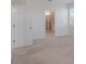 Bright bedroom with neutral carpet and door to the bathroom at 1260 Tupelo Trl, Haines City, FL 33844