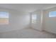 Bedroom with carpet and two windows at 1260 Tupelo Trl, Haines City, FL 33844