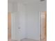 Neutral carpet in a hallway with many doors at 1260 Tupelo Trl, Haines City, FL 33844
