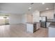 Spacious kitchen with island flowing into a bright living area at 1260 Tupelo Trl, Haines City, FL 33844
