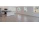 Open-concept kitchen featuring white cabinets, granite countertops, and stainless steel appliances at 1260 Tupelo Trl, Haines City, FL 33844