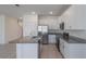 Open kitchen featuring granite countertops, stainless steel appliances, and white cabinetry at 1260 Tupelo Trl, Haines City, FL 33844