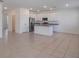 Modern kitchen with white cabinetry, stainless steel appliances, and a central island at 1260 Tupelo Trl, Haines City, FL 33844