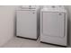 New Samsung washer and dryer in the tiled laundry room at 1260 Tupelo Trl, Haines City, FL 33844