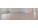 Bright living area with sliding glass doors, neutral tile flooring, and ample natural light at 1260 Tupelo Trl, Haines City, FL 33844