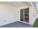 Covered patio with brick flooring and sliding glass doors at 1260 Tupelo Trl, Haines City, FL 33844