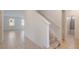 View of the staircase leading to the second floor, with natural light and neutral decor at 1260 Tupelo Trl, Haines City, FL 33844