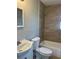Bright bathroom featuring tile floors, a vanity sink, and a bathtub at 1315 Carlsbad Pl, Orlando, FL 32808