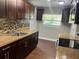 Updated kitchen with stainless steel appliances and mosaic backsplash at 1315 Carlsbad Pl, Orlando, FL 32808