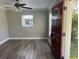 Open living room featuring hardwood floors, a ceiling fan, and a window at 1315 Carlsbad Pl, Orlando, FL 32808