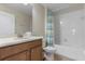 Full bathroom with a single vanity, white cabinets, and a shower-tub combination at 1494 Moon Valley Dr, Davenport, FL 33896