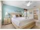 Airy bedroom featuring neutral walls, decorative headboard, and a ceiling fan at 1494 Moon Valley Dr, Davenport, FL 33896