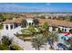Aerial view of the clubhouse with a water feature, playground, and waterslide at 1494 Moon Valley Dr, Davenport, FL 33896