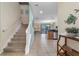 The entryway leads to the kitchen with stainless appliances, granite countertops, and tile floors at 1494 Moon Valley Dr, Davenport, FL 33896