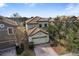 Two story home showcasing a tile roof, attached two car garage, and brick paver driveway at 1494 Moon Valley Dr, Davenport, FL 33896