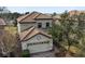 Charming two-story home featuring a two-car garage and a well-maintained tile roof at 1494 Moon Valley Dr, Davenport, FL 33896