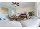 Bright living room featuring tile floors, neutral paint, ceiling fan, and comfortable seating at 1494 Moon Valley Dr, Davenport, FL 33896