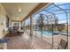 Covered patio leading to a screened pool with a safety fence at 1494 Moon Valley Dr, Davenport, FL 33896