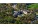 Luxury brick estate with a private pool nestled among lush greenery and mature trees at 1501 Lake Markham Rd, Sanford, FL 32771