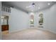 Bright bedroom with views of the pool and outdoor landscape at 1501 Lake Markham Rd, Sanford, FL 32771