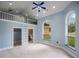 Spacious bedroom with high ceilings, a loft, large windows, and ensuite bathroom at 1501 Lake Markham Rd, Sanford, FL 32771
