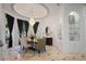 Formal dining room with elegant chandelier, decorative ceiling, dark curtains and a window overlooking the landscape at 1501 Lake Markham Rd, Sanford, FL 32771