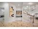 Grand entryway with staircase and built-in bar area at 1501 Lake Markham Rd, Sanford, FL 32771