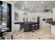 Eat-in kitchen with black island, stainless steel appliances, breakfast bar, and large windows overlooking the outdoor pool at 1501 Lake Markham Rd, Sanford, FL 32771