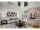 Bright living room with high ceilings, neutral decor, a view into the foyer, and adjacent bar area at 1501 Lake Markham Rd, Sanford, FL 32771