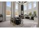 Spacious living room with soaring ceilings, fireplace, large windows, and neutral decor at 1501 Lake Markham Rd, Sanford, FL 32771
