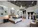 Luxurious main bedroom with elegant lighting, built-in shelving, fireplace, and sitting area at 1501 Lake Markham Rd, Sanford, FL 32771