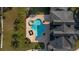 Aerial view of an inviting backyard pool and spa with a spacious patio area at 1501 Lake Markham Rd, Sanford, FL 32771