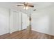 Bedroom with hardwood floors, a ceiling fan and a closet at 1744 E Welch Rd, Apopka, FL 32712