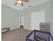 Bedroom features a closet and a play area with a crib and a desk at 1843 Van Allen Loop, Auburndale, FL 33823