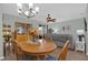 Inviting dining room with a wooden table and view into the open living area at 1843 Van Allen Loop, Auburndale, FL 33823