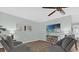 Cozy Gathering room with a large screen television, comfortable seating, and wood-look tile at 1843 Van Allen Loop, Auburndale, FL 33823