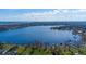 Overhead view showcasing tranquil lake access with private docks and lush surroundings at 1910 Lake Roberts Landing Dr, Winter Garden, FL 34787