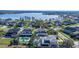 Expansive aerial view showcasing home with screened pool and lake views at 1910 Lake Roberts Landing Dr, Winter Garden, FL 34787